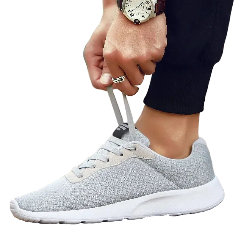 Gray Men's Malcom Sneaker featuring a breathable mesh design and comfortable walking sole.