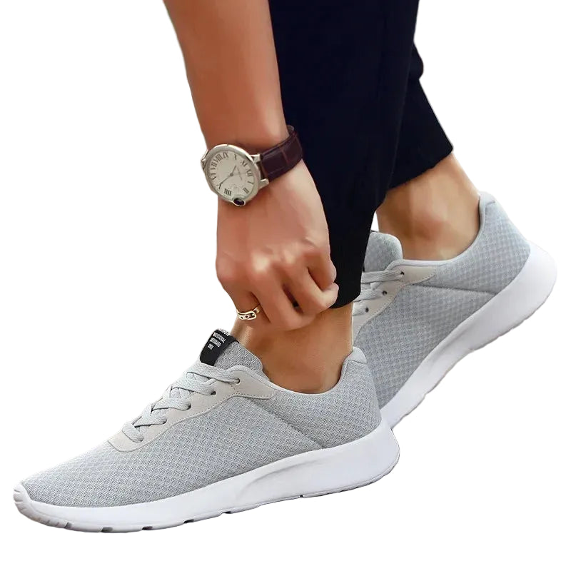 Men's Malcom Sneaker in gray with breathable mesh upper and cushioned sole for walking and daily wear.