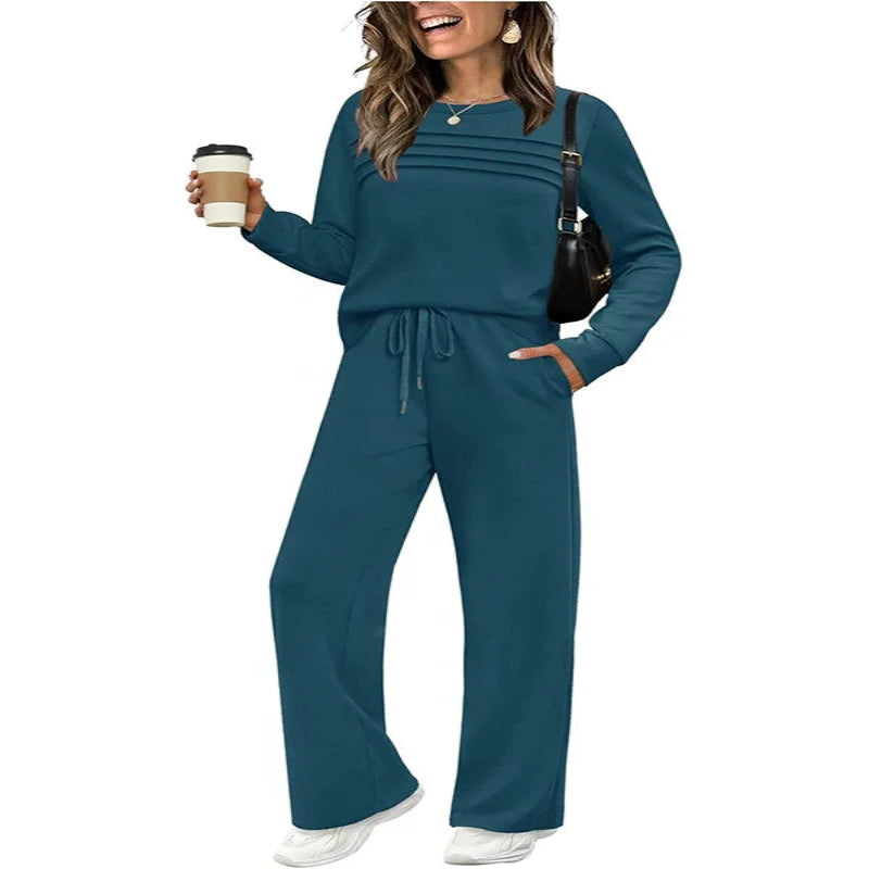 Woman wearing a teal matching set with a white background