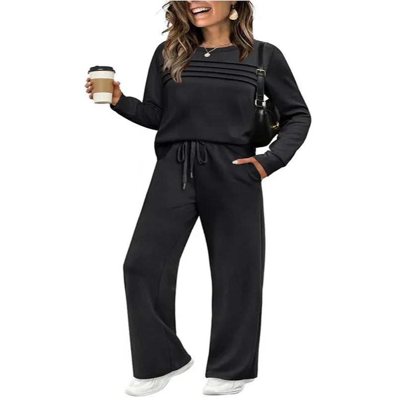 Woman wearing a black outfit holding a coffee cup on a white background