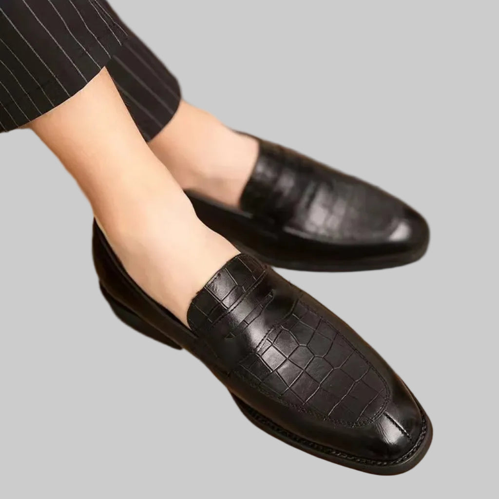 Luxury men’s British crocodile loafers in brown leather, top view