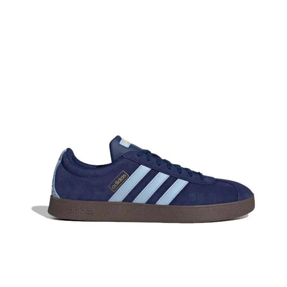 Navy blue Retro Low Top Sneakers with three white stripes on a white background
