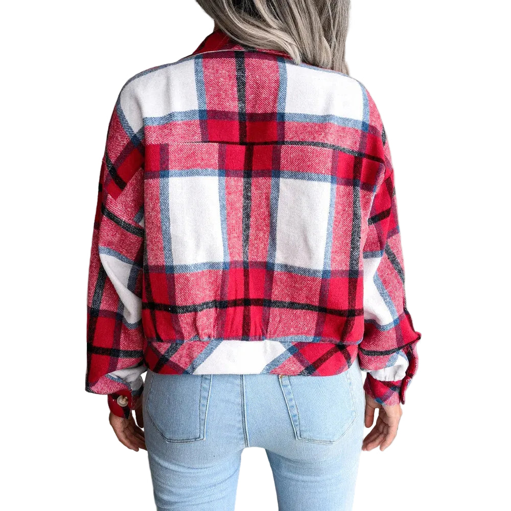 Person wearing a red and white plaid shirt in a living room setting