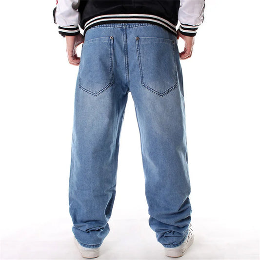 Blue jeans worn by a person on a white background