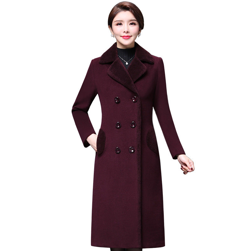 Maroon coat worn by a model on a white background