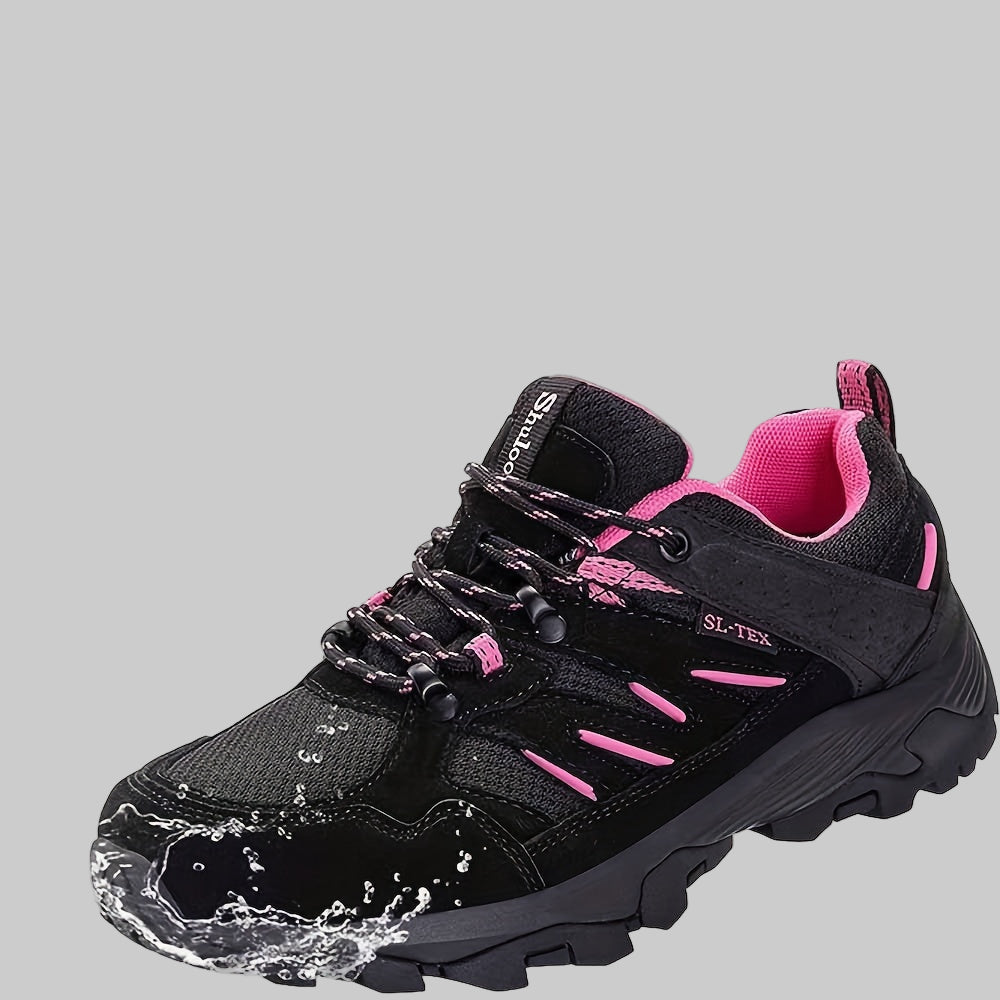 Black and pink women’s non-slip hiking shoes with SL-TEX waterproof technology label and water splashes.