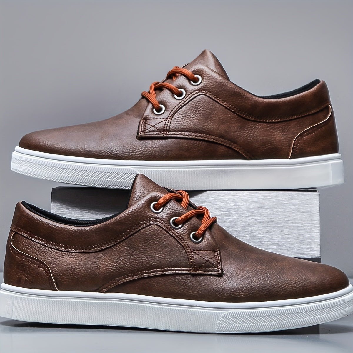 Modern men's PU leather skate shoes with a stylish and durable design.