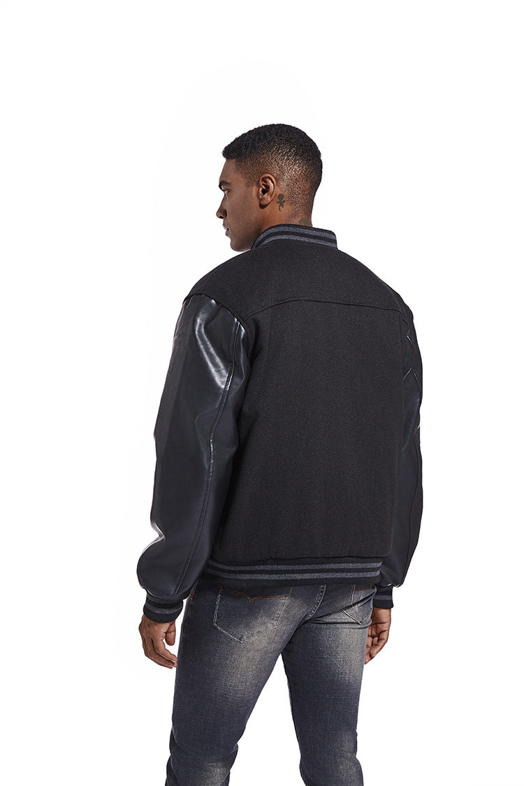 Man wearing a black leather jacket with reflective panels on a white background