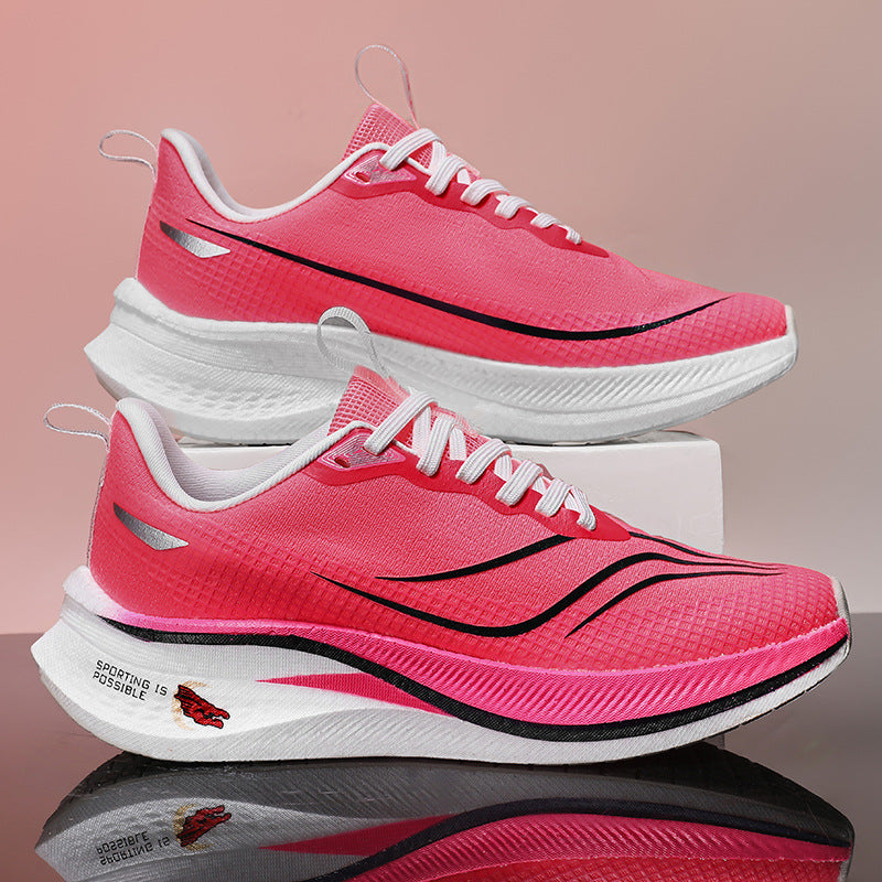 Pink running shoes with white soles on a reflective surface and gradient background