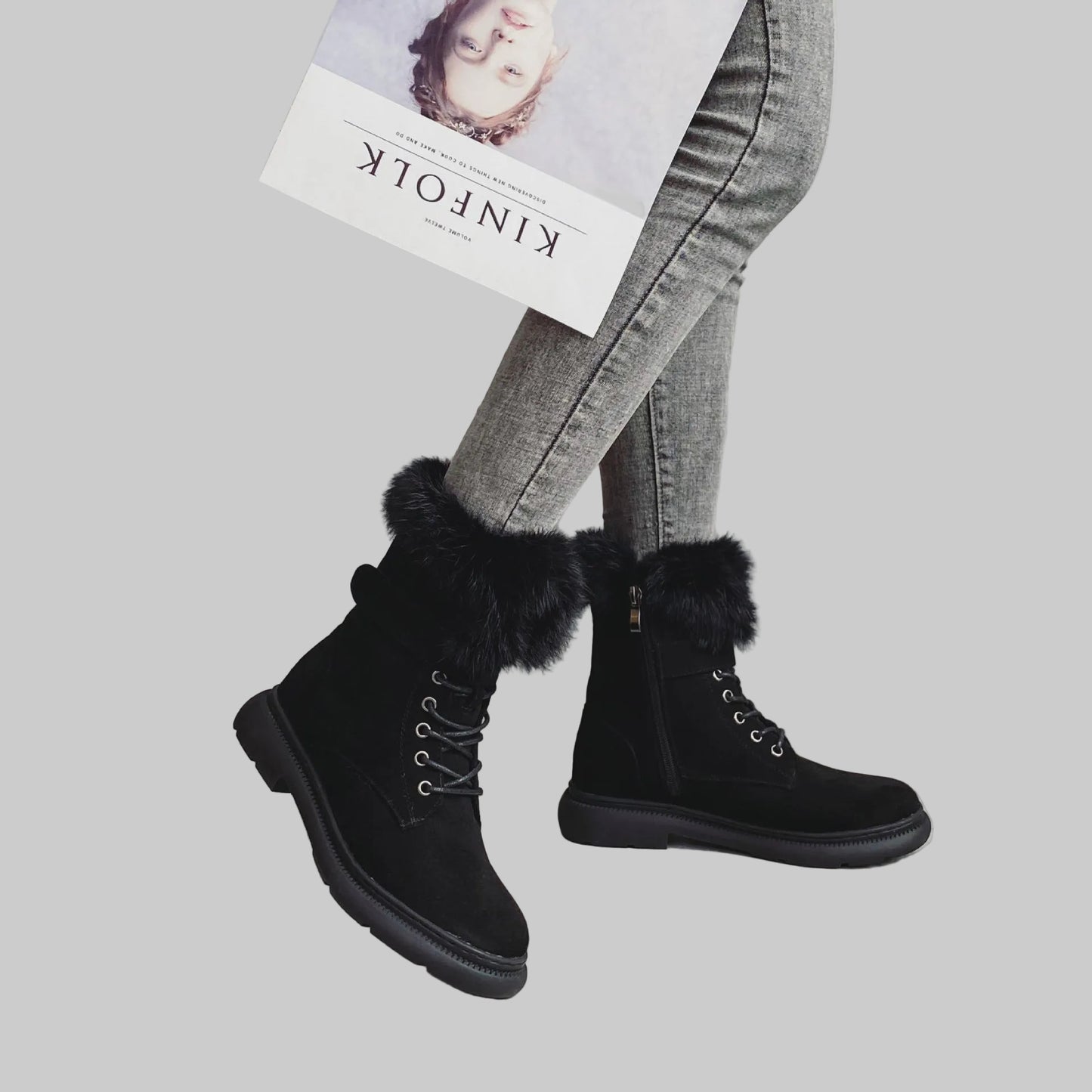 Women wearing faux fur winter platform boots with lace-up front, casual cold-weather outfit.
