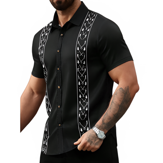 Black short-sleeve guayabera shirt with white embroidery on a white background