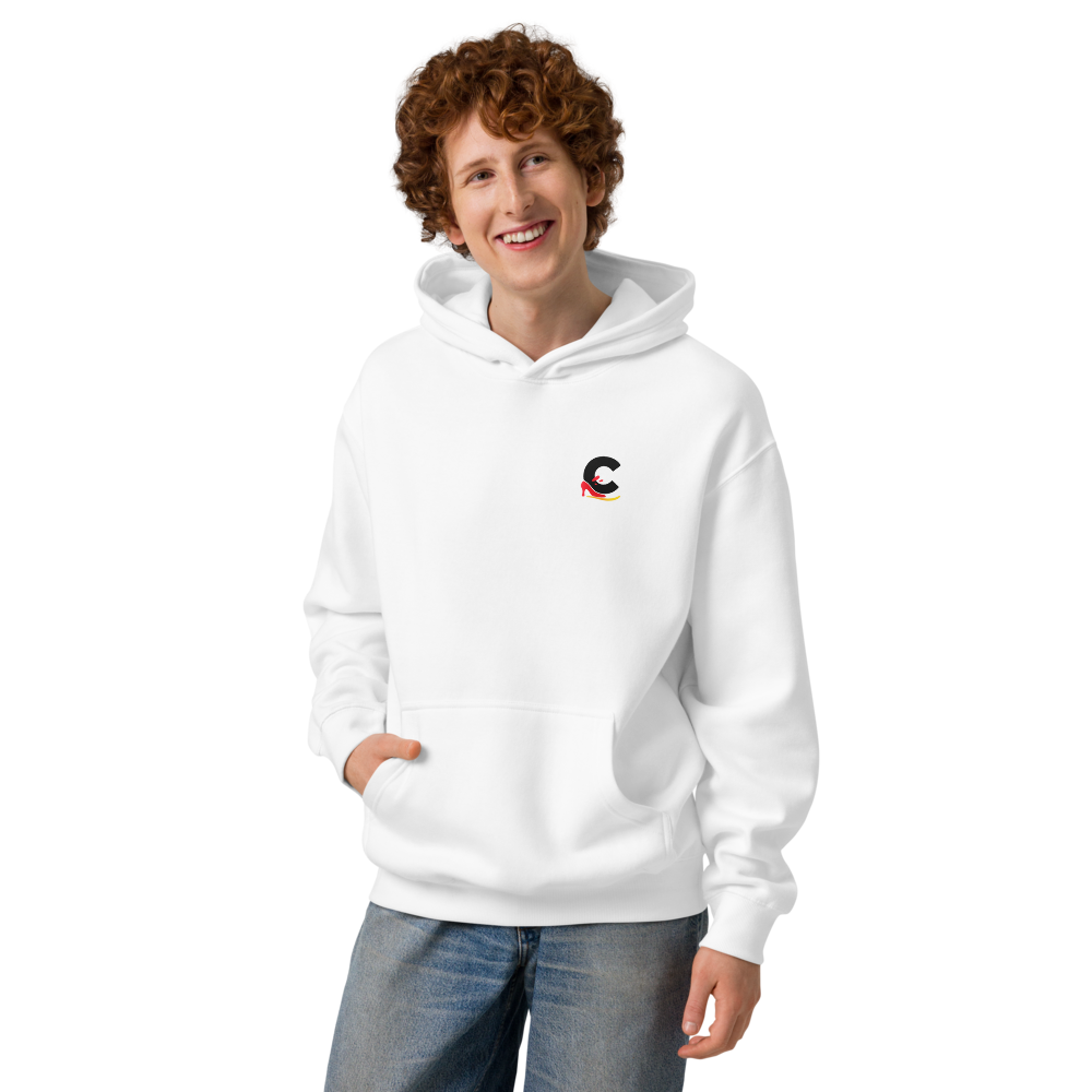 Young man wearing a white unisex streetwear logo hoodie by Casual Flow Shop